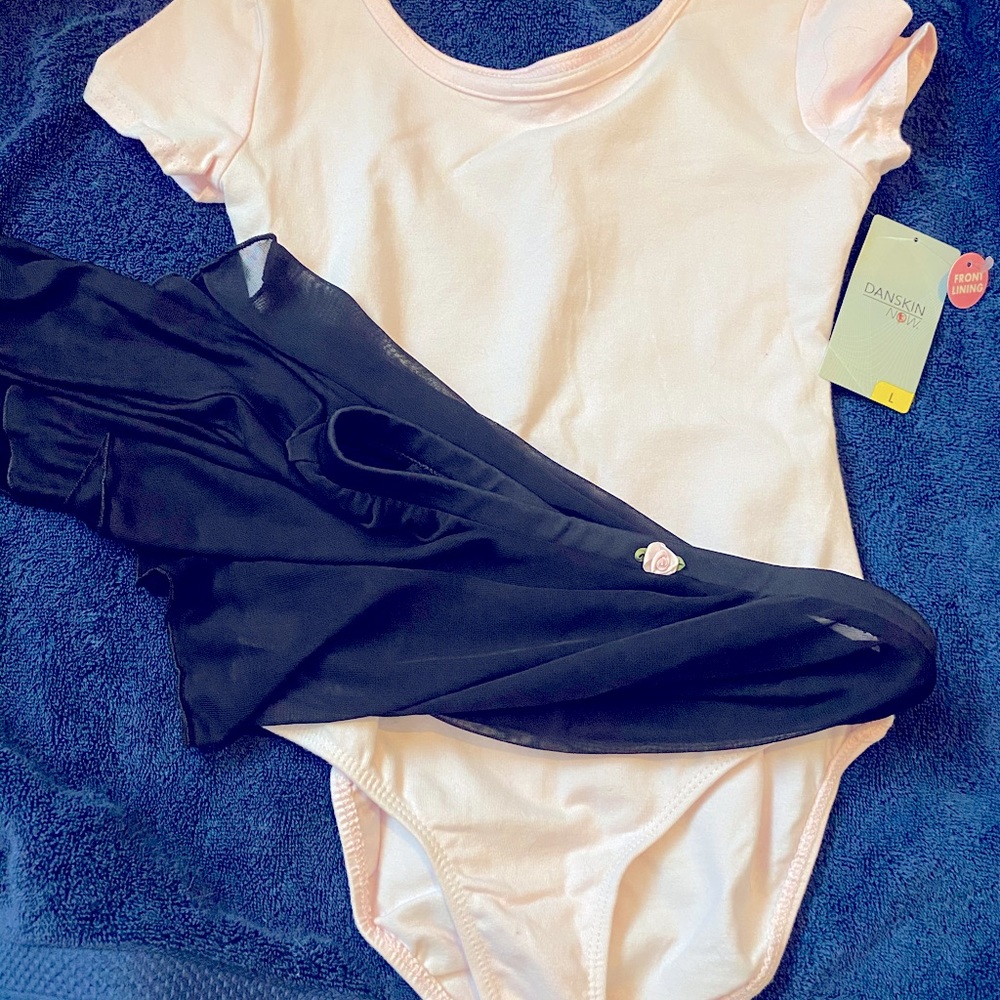 Pink leotard with black skirt